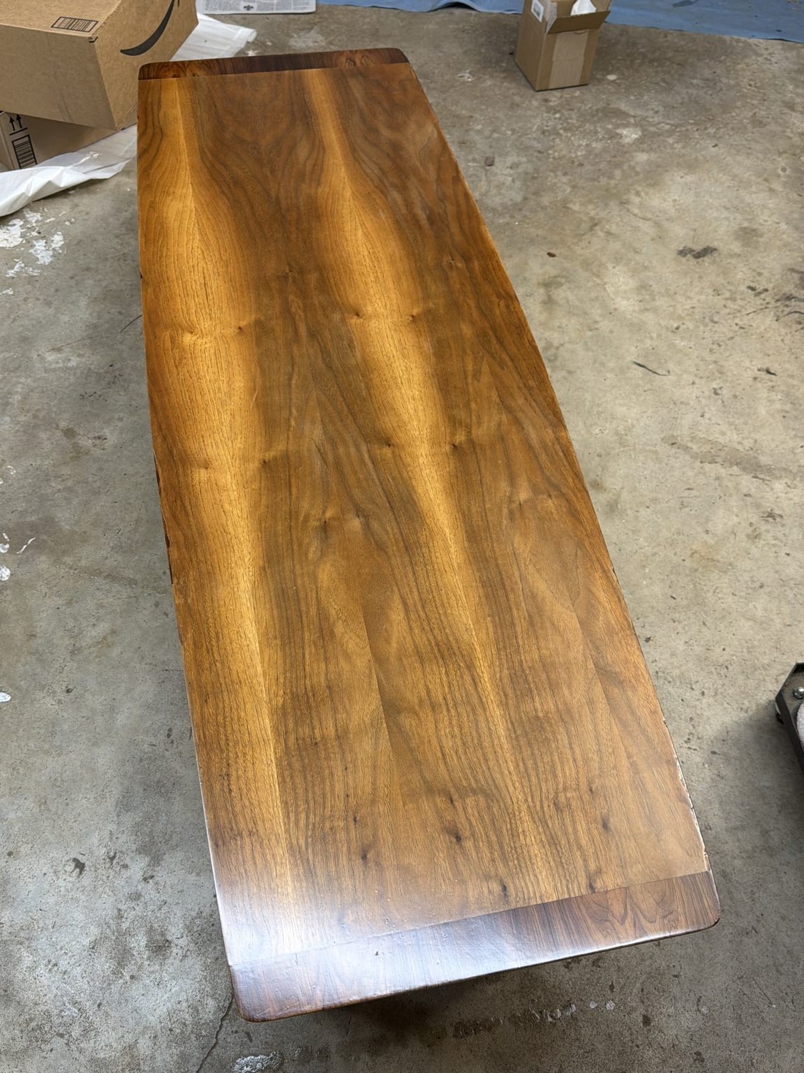 Close view of the restored wood top on a mid-century modern coffee table